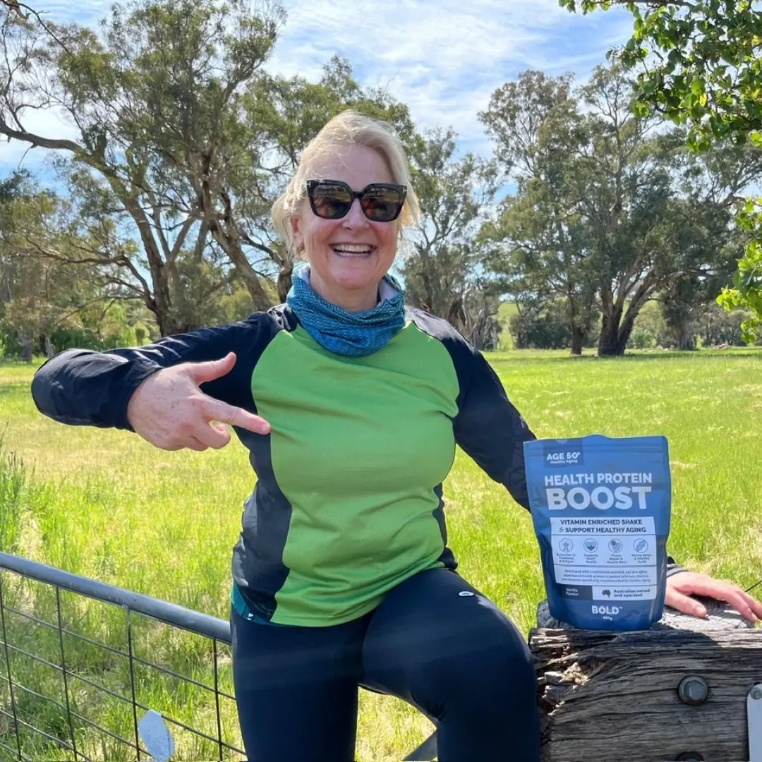 Woman outdoors with Health Protein Boost pouch