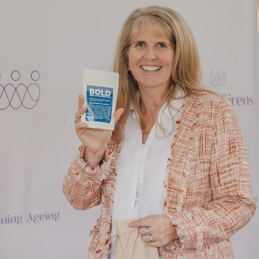 Customer holding BOLD Health Protein Plus sachet